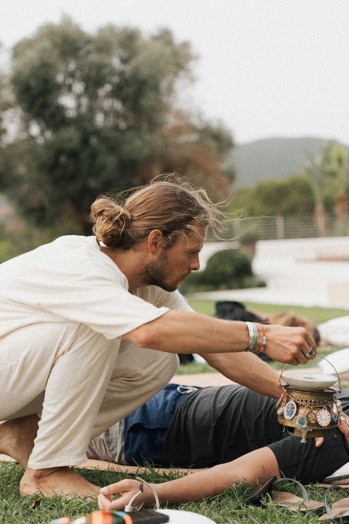 David holding space with a singing bowl, personal attention, Ibiza 2024